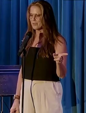 Clean comedian Sandra LaFlamme on stage at a corporate and church event